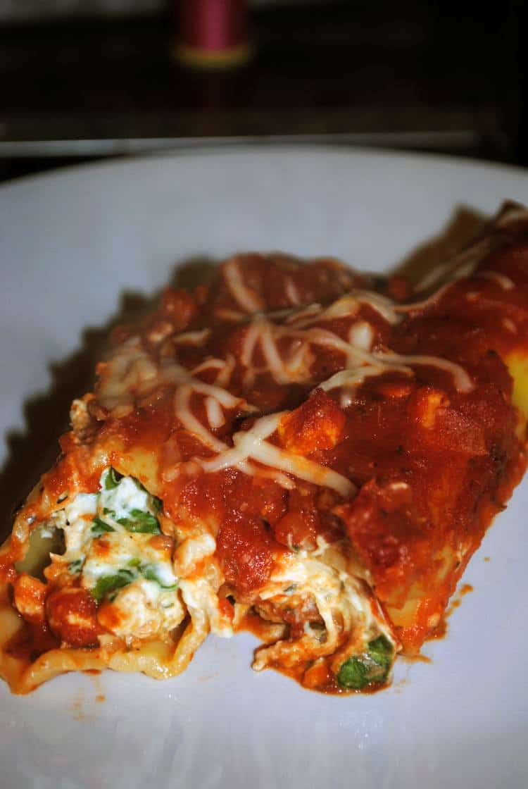 Chicken manicotti is Italian comfort food at its best. Chicken, cheeses, and a rich tomato sauce tucked into pasta shells and baked up with even more cheese. Dinner never tasted so good.