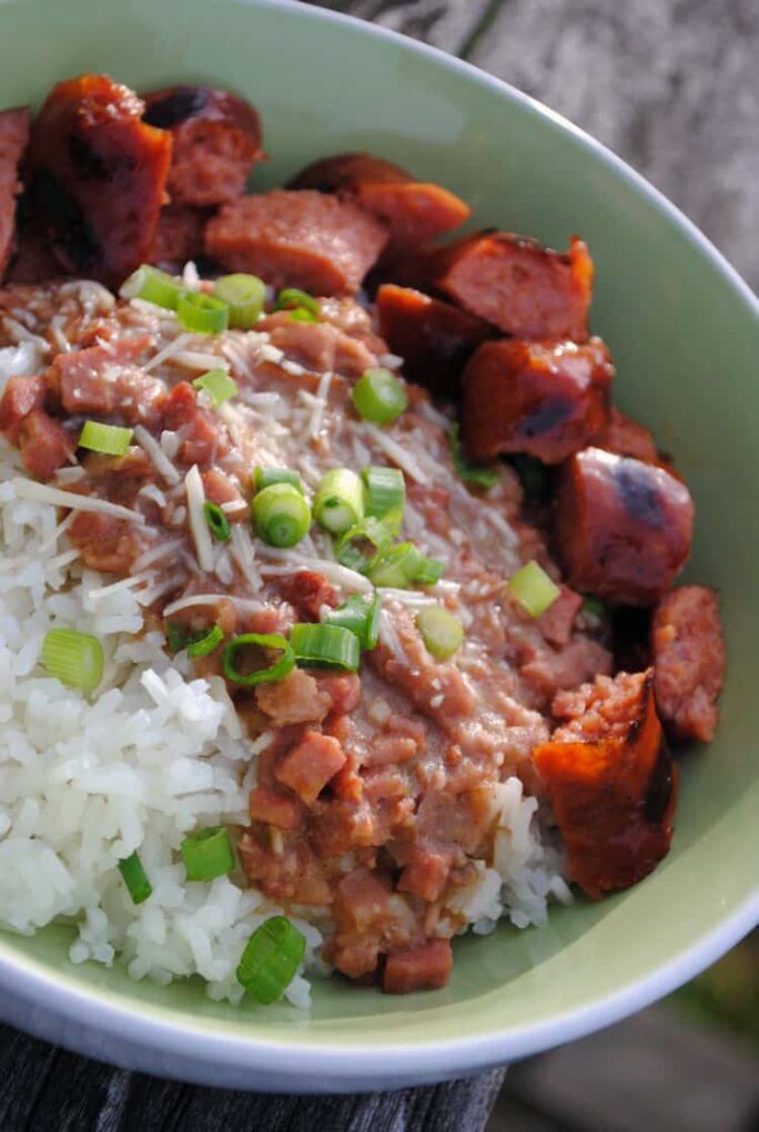 New Orleans style red beans and rice has all of the flavors you expect in Cajun food, plus bacon! Really, you can add just about anything you want with bacon and it will be awesome. | Recipe from passthesushi.com