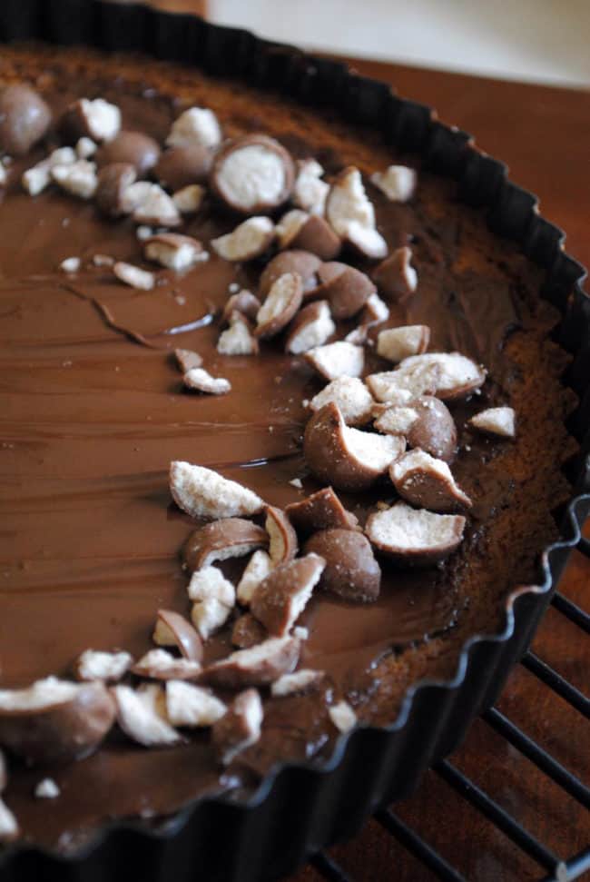 Malted milk cookie tart. A buttery, malted milk cookie crust topped with chocolate and malted milk balls. The dessert of champions! | Get the recipe on PassTheSushi.com