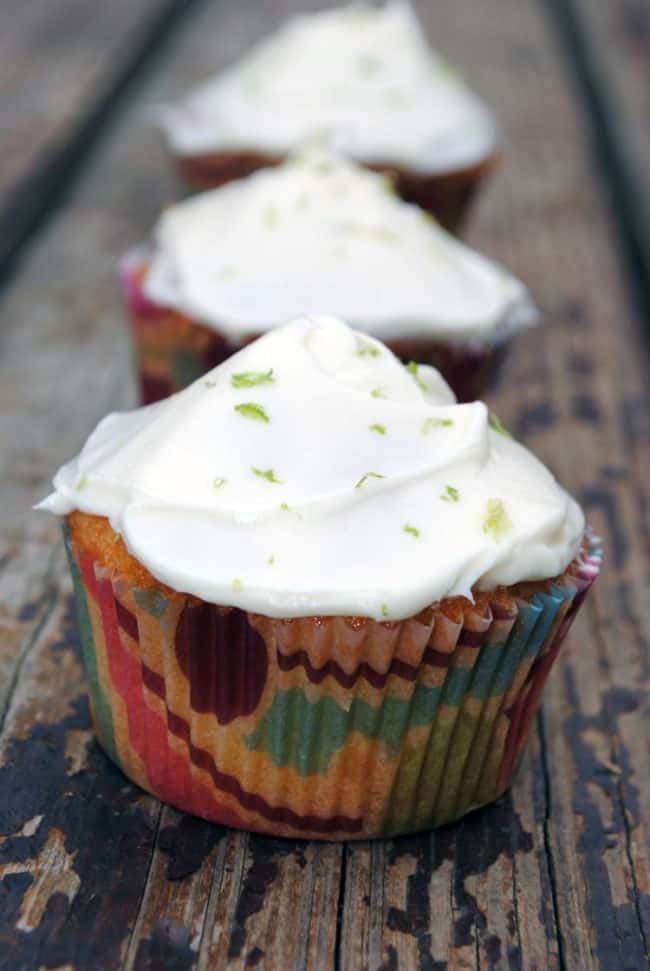 Key Lime Coconut Cupcakes are a taste of summer sunshine. With bright lime and coconut flavors in the moist cupcake and a lime cream cheese frosting on top, you'll want to devour these treats! | Recipe from passthesushi.com