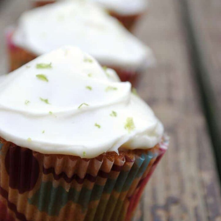 Key Lime Coconut Cupcakes are a taste of summer sunshine. With bright lime and coconut flavors in the moist cupcake and a lime cream cheese frosting on top, you'll want to devour these treats!
