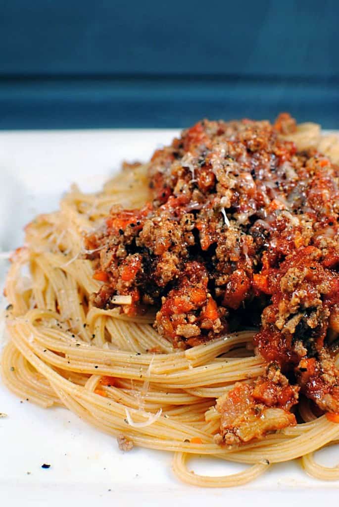 Bolognese Sauce is a hearty Italian meat sauce that's loaded with flavor. Served with your favorite pasta, it's a comfort food dish that you're going to love. \\ Get the recipe on PassTheSushi.com