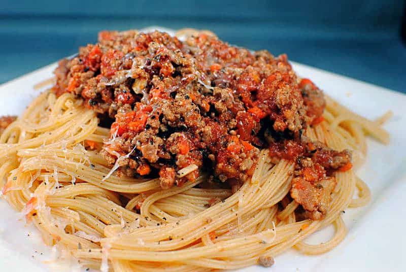 Bolognese Sauce is a hearty Italian meat sauce that's loaded with flavor. Served with your favorite pasta, it's a comfort food dish that you're going to love. \\ Get the recipe on PassTheSushi.com
