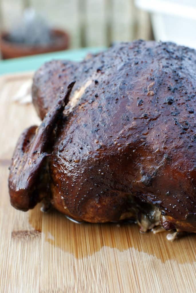 Simple Mesquite Smoked Chicken on a cutting board \ by PassTheSushi.com
