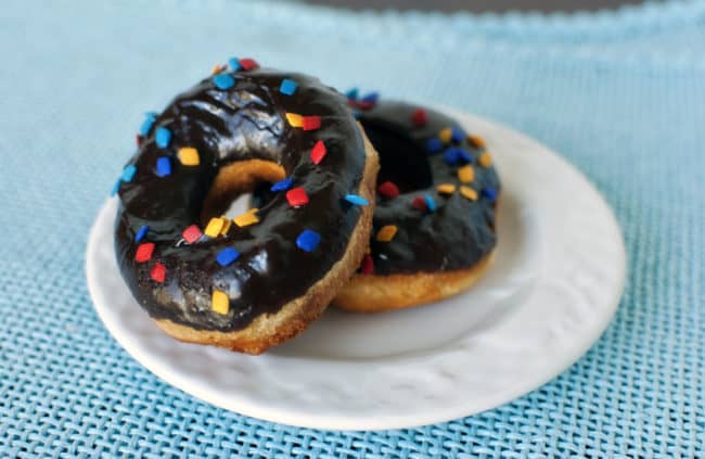 Chocolate frosted doughnuts on a plate | passthesushi.com