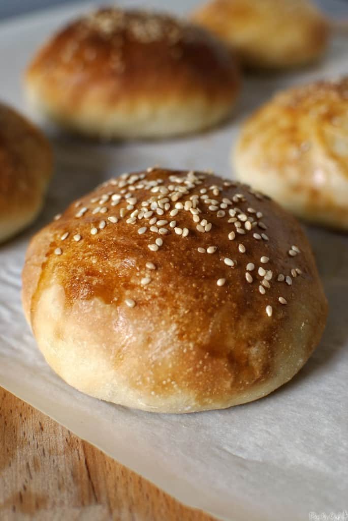 Homemade light brioche buns are light and tender on the inside and golden crispy on the outside. Sturdy enough for a burger, yet soft enough for an every day dinner roll.