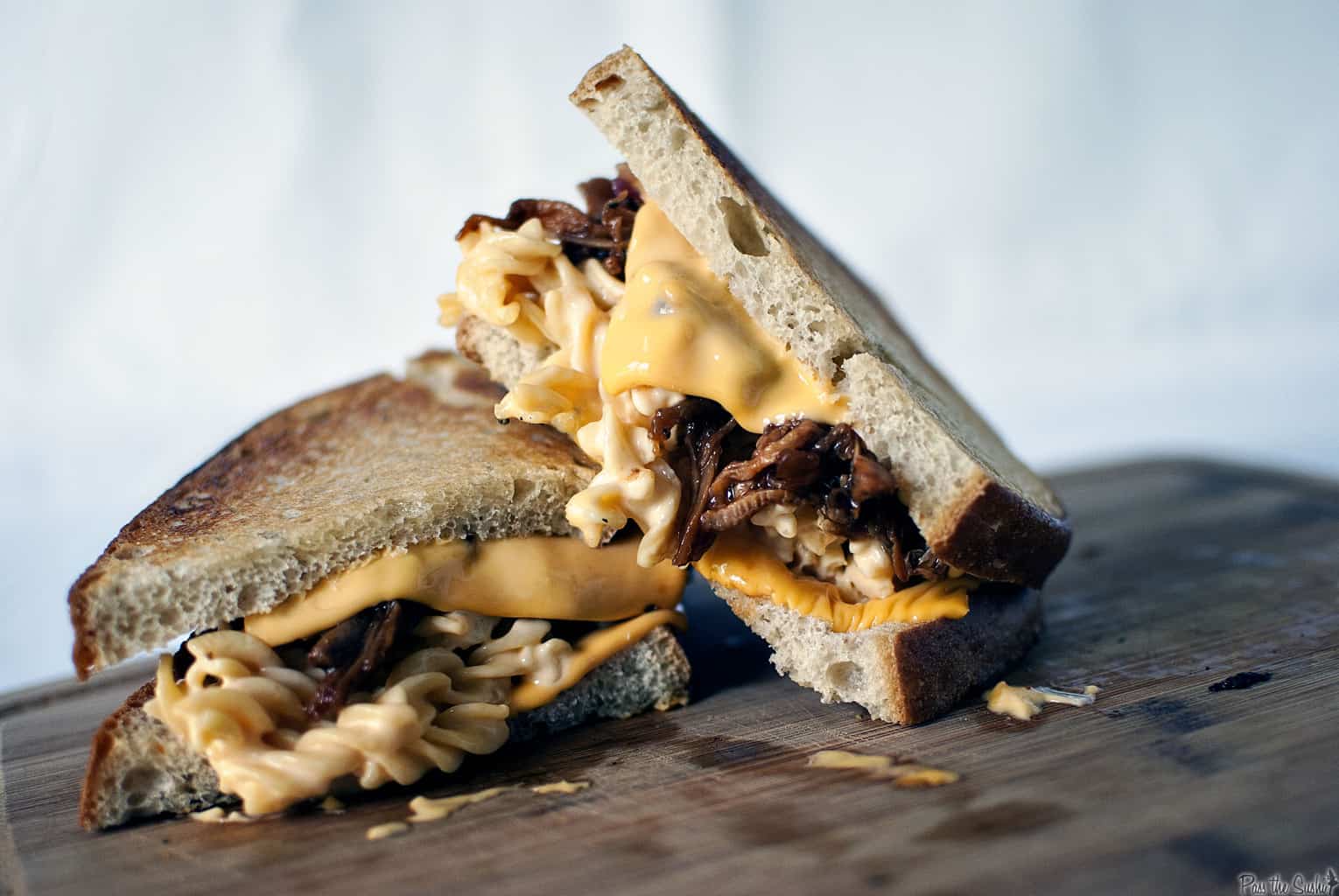 The Man-wich is a grilled mac and cheese with pulled pork. A carb lover's sandwich from Pass the Sushi.