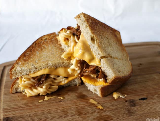 The Man-wich is a grilled mac and cheese with pulled pork. A carb lover's sandwich from Pass the Sushi.