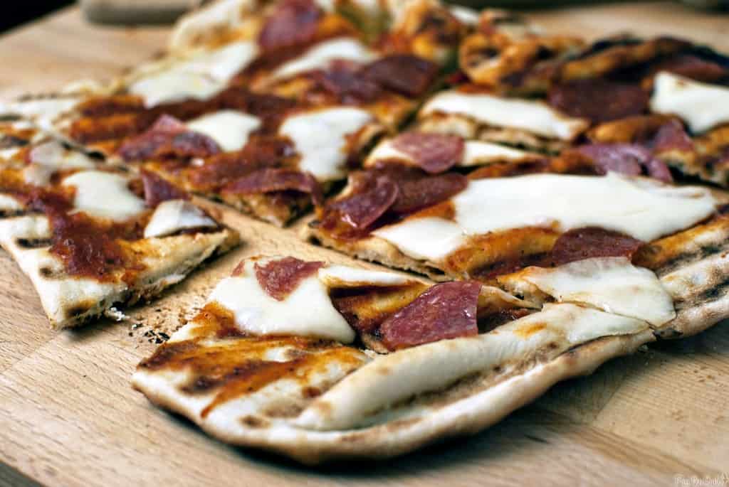 This grilled everything pizza recipe pairs your love for grilling and your love for pizza. Grilled meats, marinara sauce, fresh herbs and hot melted cheese.