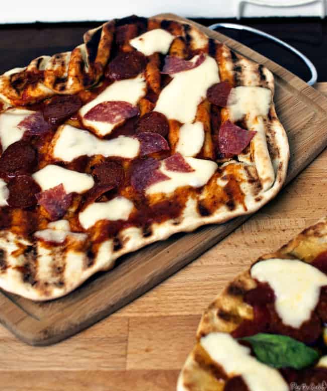 This grilled everything pizza recipe pairs your love for grilling and your love for pizza. Grilled meats, marinara sauce, fresh herbs and hot melted cheese.