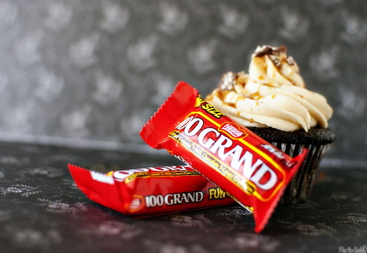 100 Grand cupcakes are dessert heaven. 100 Grand candy bars, stuffed inside and on top of moist chocolate cupcakes. With a caramel drizzle and fluffy buttercream frosting. \\ PassTheSushi.com