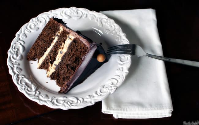 Chocolate peanut butter layer cake. Chocolate cake layered with creamy peanut butter filling and topped with rich chocolate frosting.