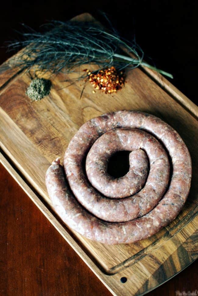 Learn how to make spicy Italian sausage from scratch! From grinding and flavoring the meat to filling and cooking the casings, this post will show you how!