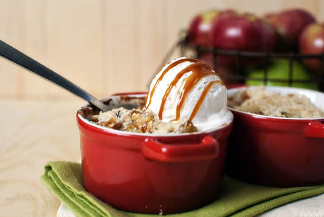 Apple cinnamon crumble is the perfect fall dessert! Juicy apples, warm spices, and a crumble topping, with a scoop of vanilla ice cream and caramel to sweeten the pot. \\ PassTheSushi.com