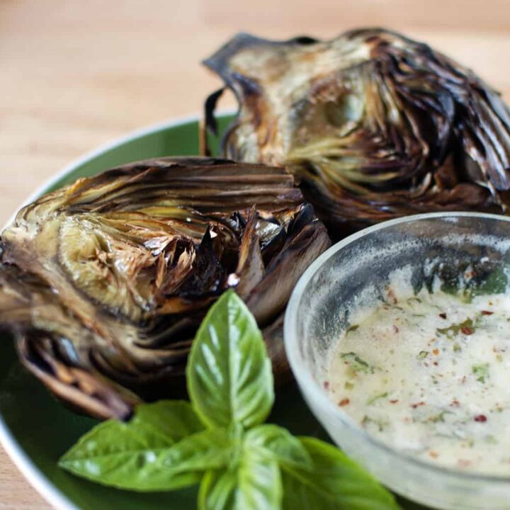 Grilled artichokes have an amazing flavor that you must taste to believe! Grilling artichokes is so easy to do, there's no reason not to try this recipe! \\ passthesushi.com