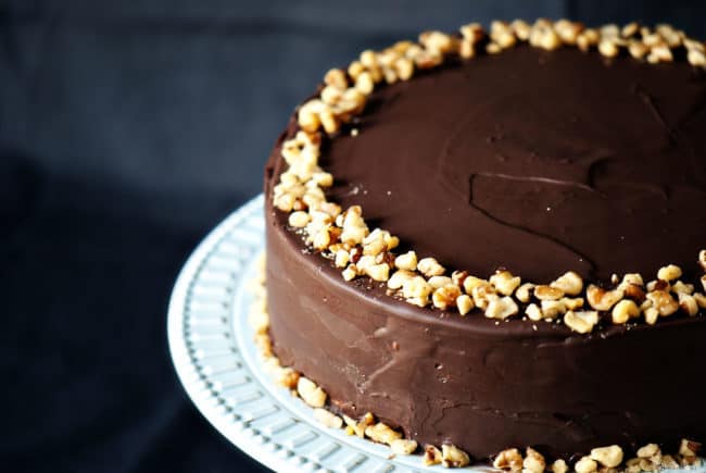 Banana Cake with Chocolate Glaze is a classic banana layer cake accented with cinnamon. The cake is covered in a thick chocolate glaze. \\ PassTheSushi.com