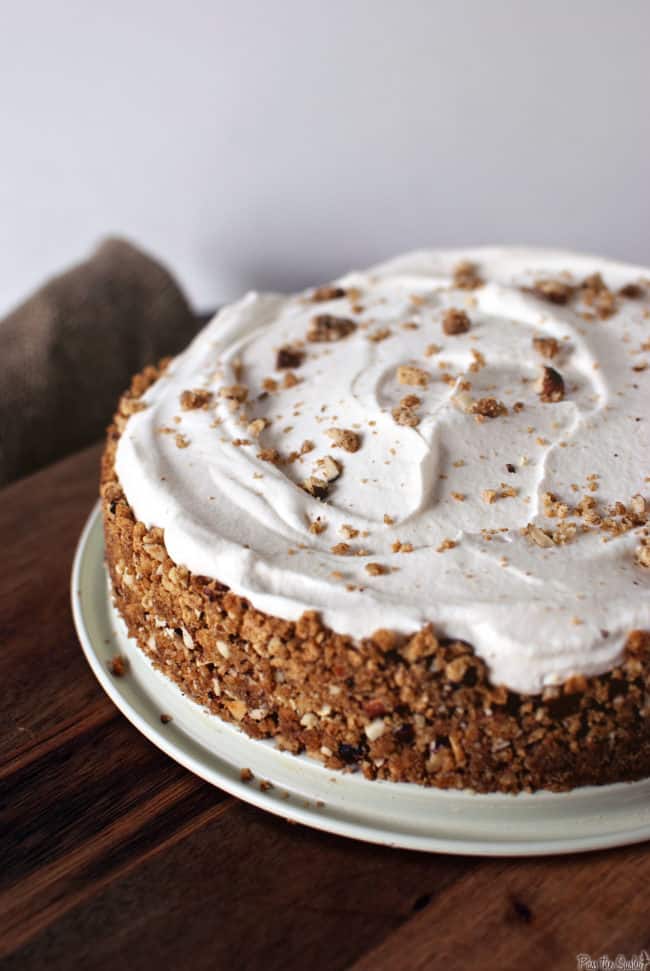 light chai wipped cream over cinnamon pudding pie with crushed hazelnut crust