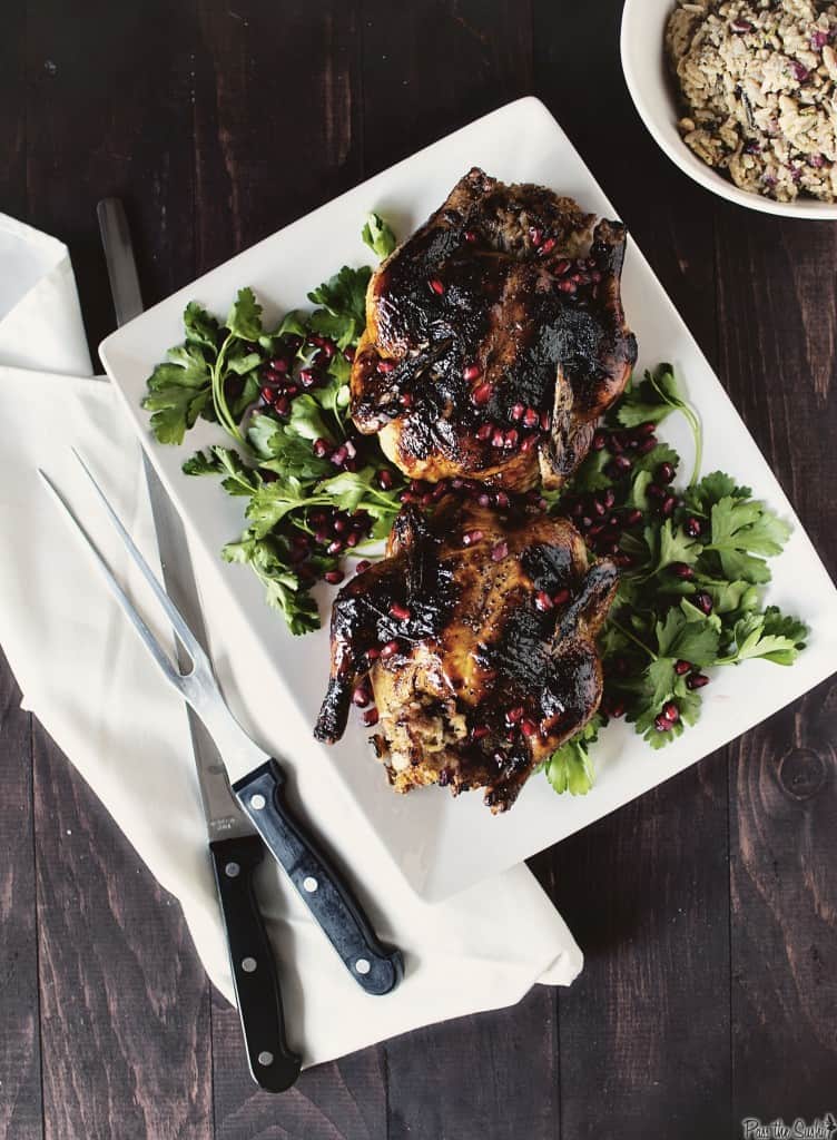 Christmas dinner at its finest includes making Glazed Cornish Hens with Pomegranate-Rice Stuffing. Elegant, but incredibly easy to make, and gorgeous, too. | PassTheSushi.com