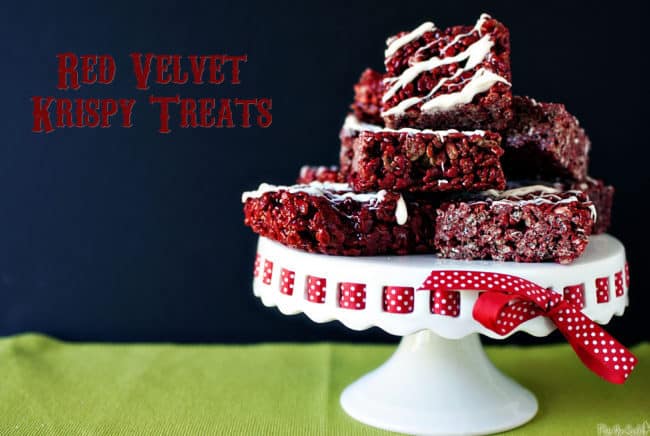A pile of individual red velvet rice crispies piled up for snacking with a white chocolate drizzle - so good! 