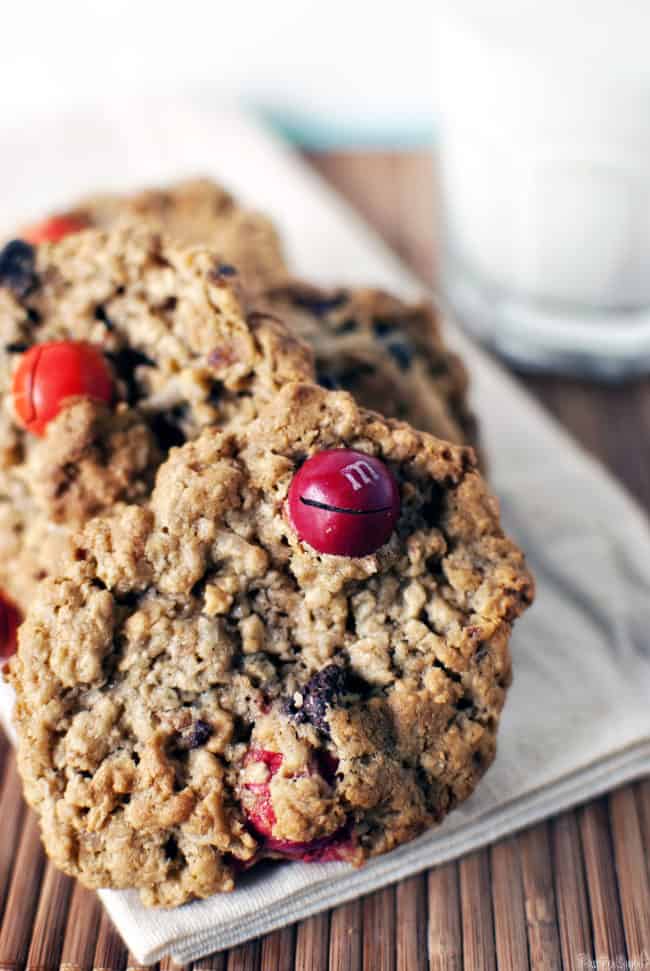 Kitchen sink cookies are chewy oatmeal cookies, loaded with peanut butter, coconut, chocolate candies, pretzels, and raisins. You know, everything but the kitchen sink! \\ PassTheSushi.com