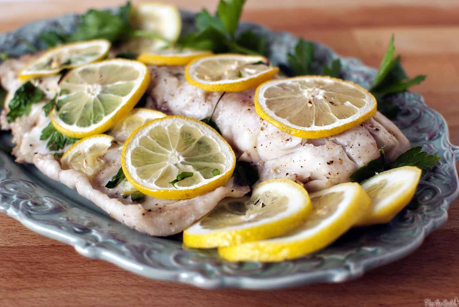 Baked fish is a healthy choice for lunch or dinner. Lemon and fresh parsley give this baked fish dinner a huge burst of flavor. \\ PassTheSushi.com