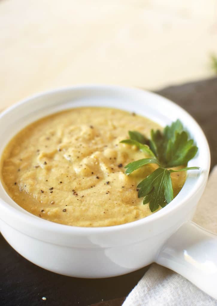 Roasted garlic cauliflower soup is rich, creamy, and despite the lack of meat, it's a hearty, flavorful soup. \\ PassTheSushi.com