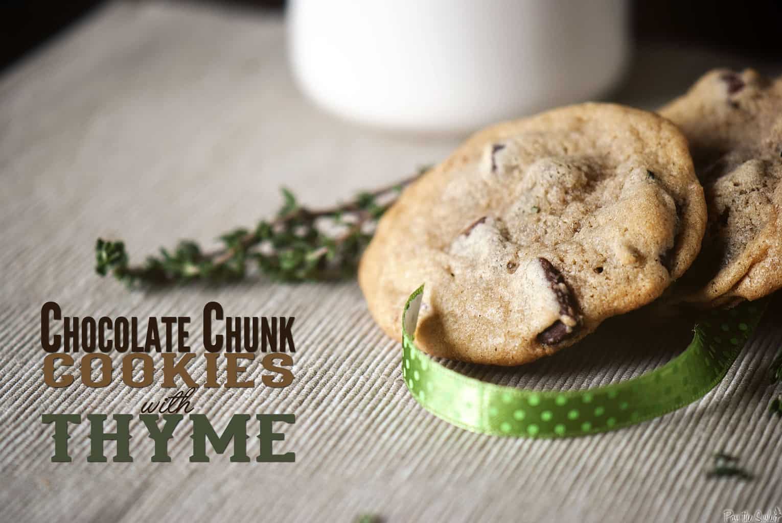 Chewy chocolate chip cookies with thyme sprigs and a ribbon.