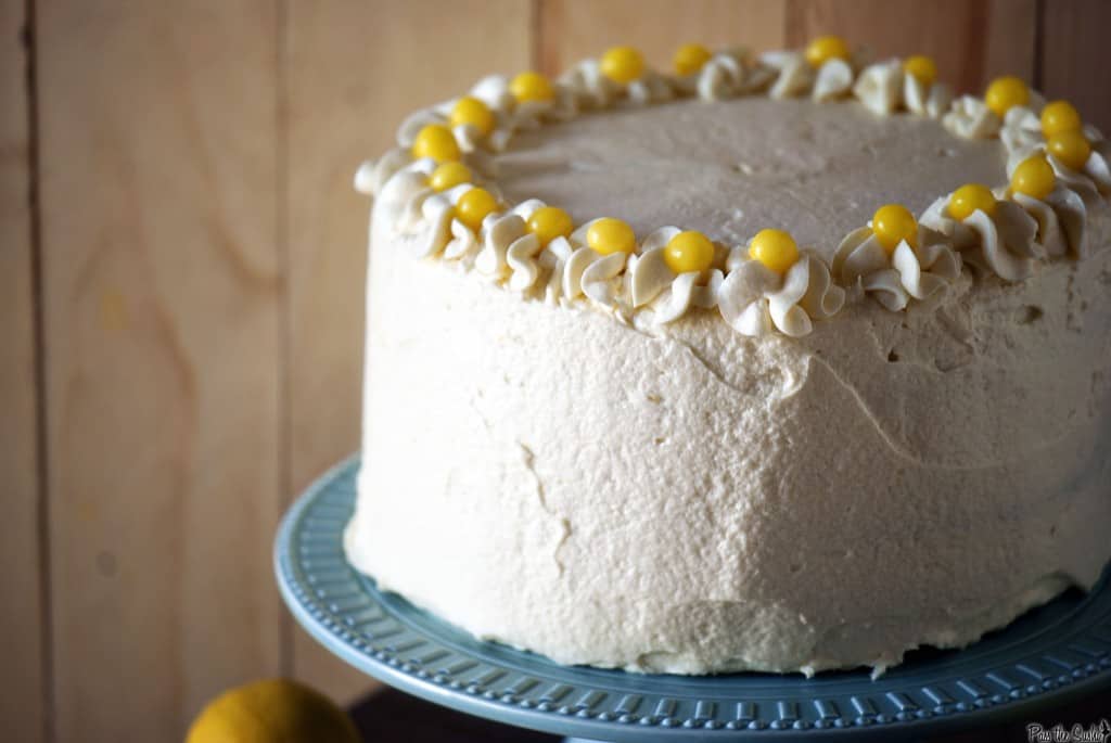 Cake With white frosting and lemon drop candies on top | Kita Roberts PassTheSushi.com