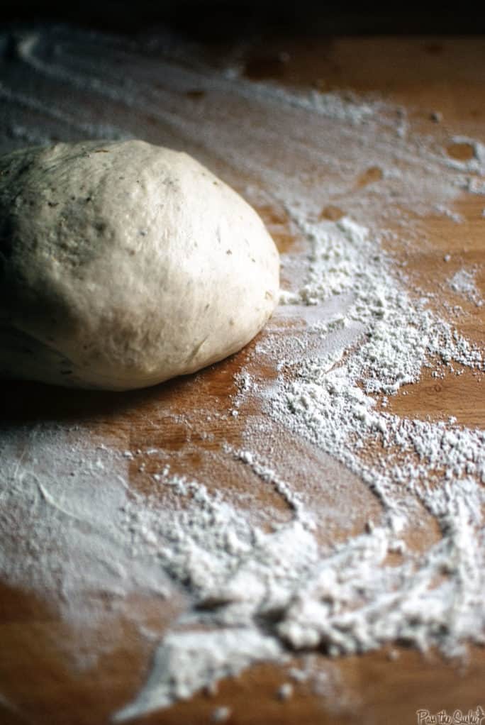 Dough shaped into a ball on a floured counter | Kita Roberts PassTheSushi.com