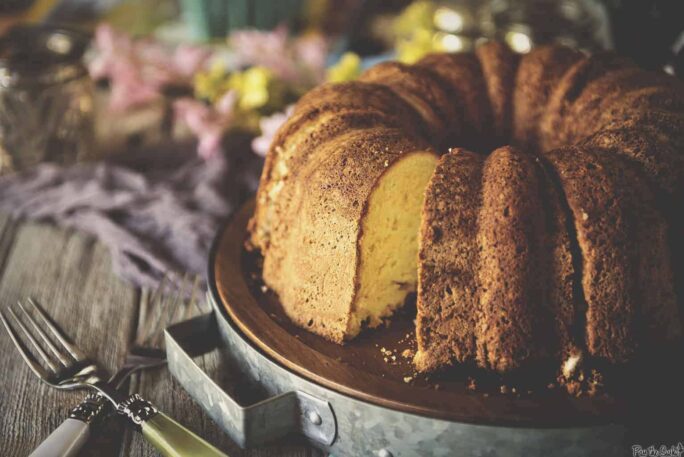 Rum Cake on a wooden platter | Kita Roberts PassTheSushi