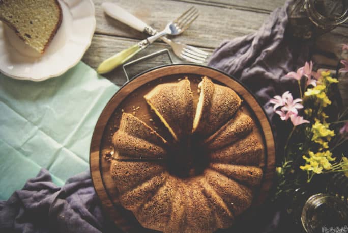 Rum Cake Shown with flowers and napkins | Kita Roberts PassTheSushi