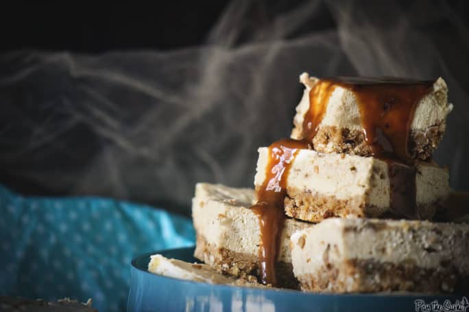 Bananas Foster Cheesecake bars with caramel drizzling over the top 