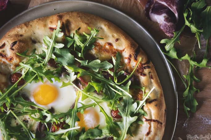 Overhead shot of grilled breakfast pizza.