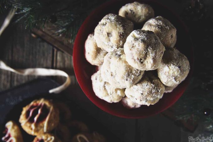 Russian Tea Cake Cookies {Pecan Snowballs} in a red bowl | Kita Roberts PassTheSushi.com