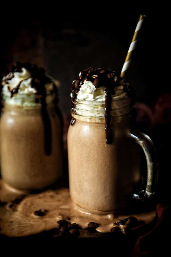 Milkshake with whipped cream and chocolate drizzle in a glass jar with handle | Kita Roberts PassTheSushi.com