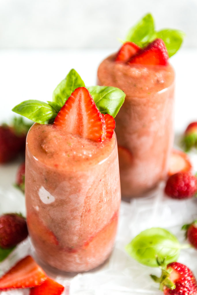 Roasted balsamic strawberries blended for a frozen gin and tonic with basil!