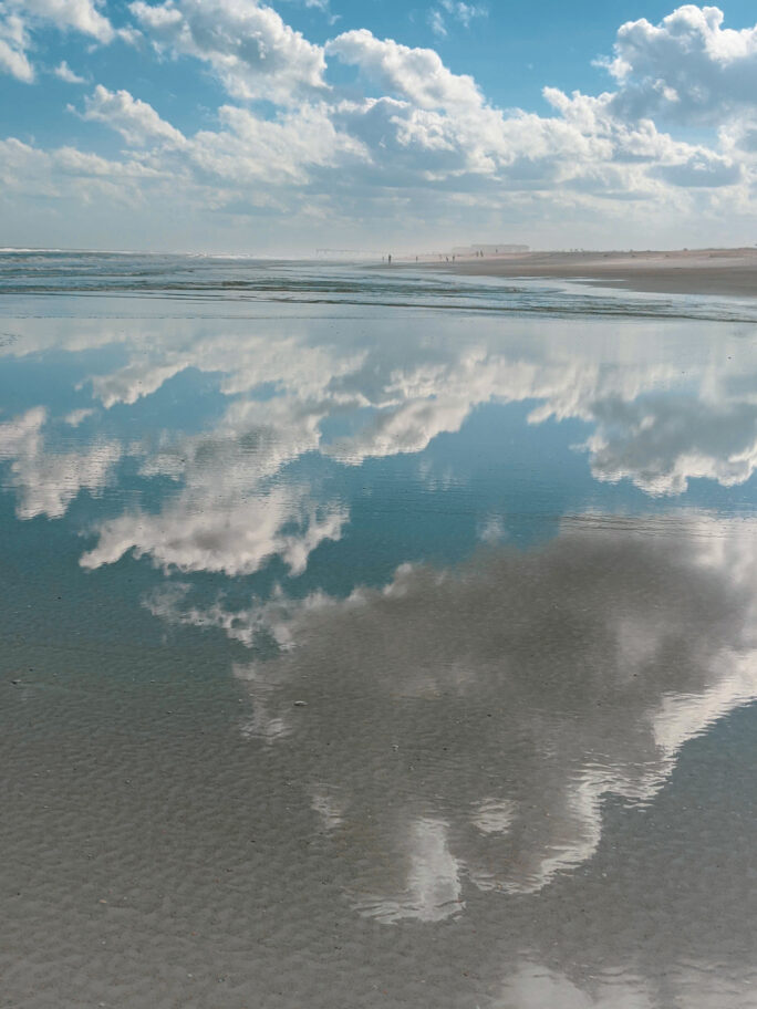 Reflection of the sky in the smooth waters of Anastasia state park beach