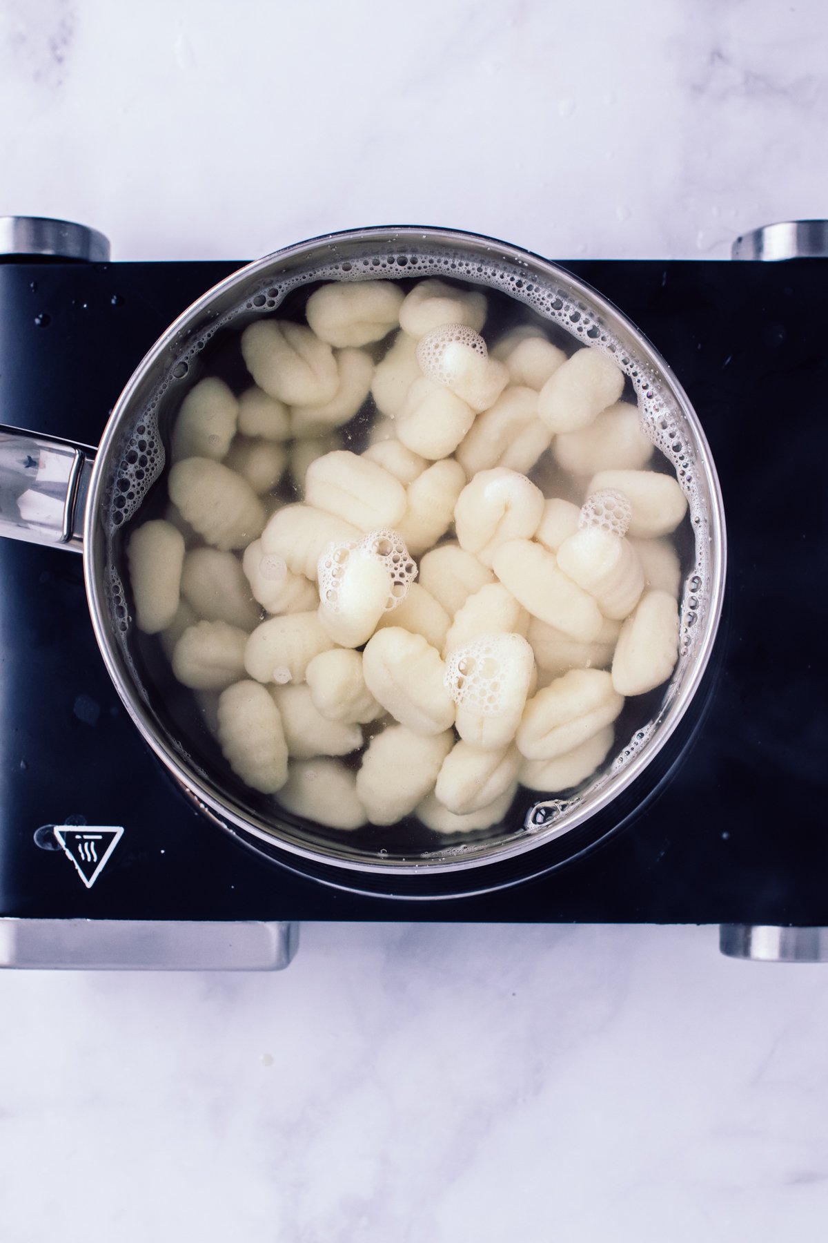 Gnocchi in a pot to boil. 