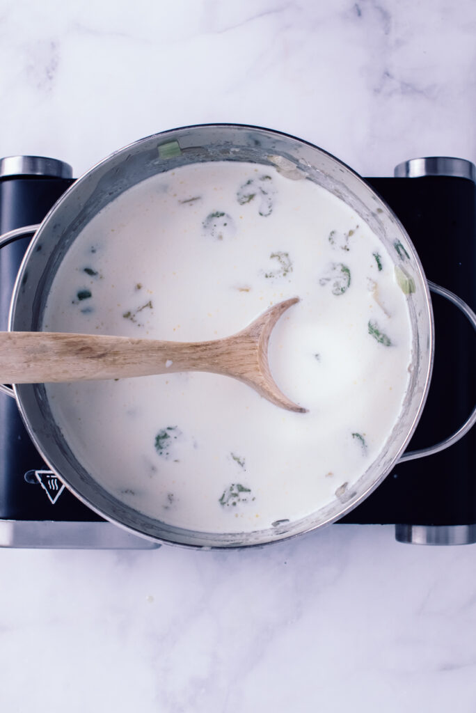 adding cream to the Chicken Gnocchi Soup