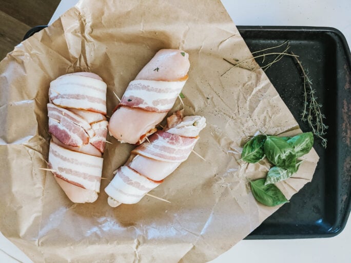 wrapping the chicken with bacon