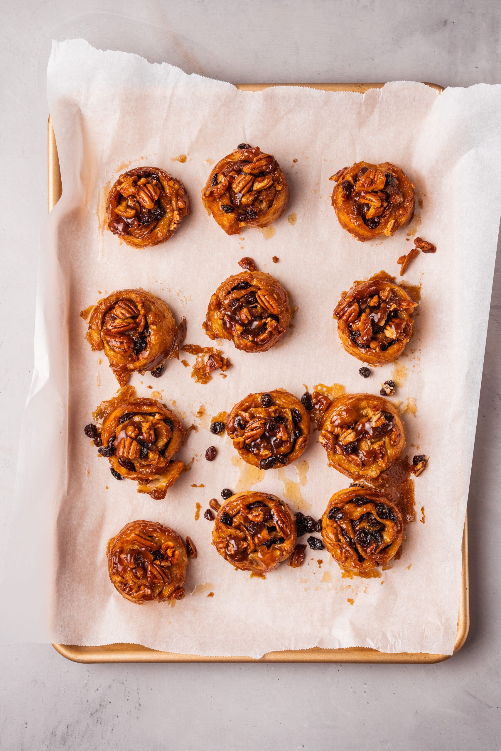 sticky buns laid out on a cookie sheet