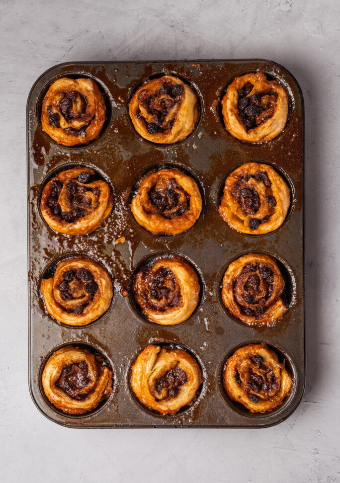 muffin pan with fully-cooked buns