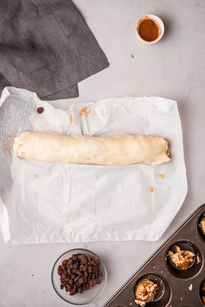 rolling up dough into a loaf