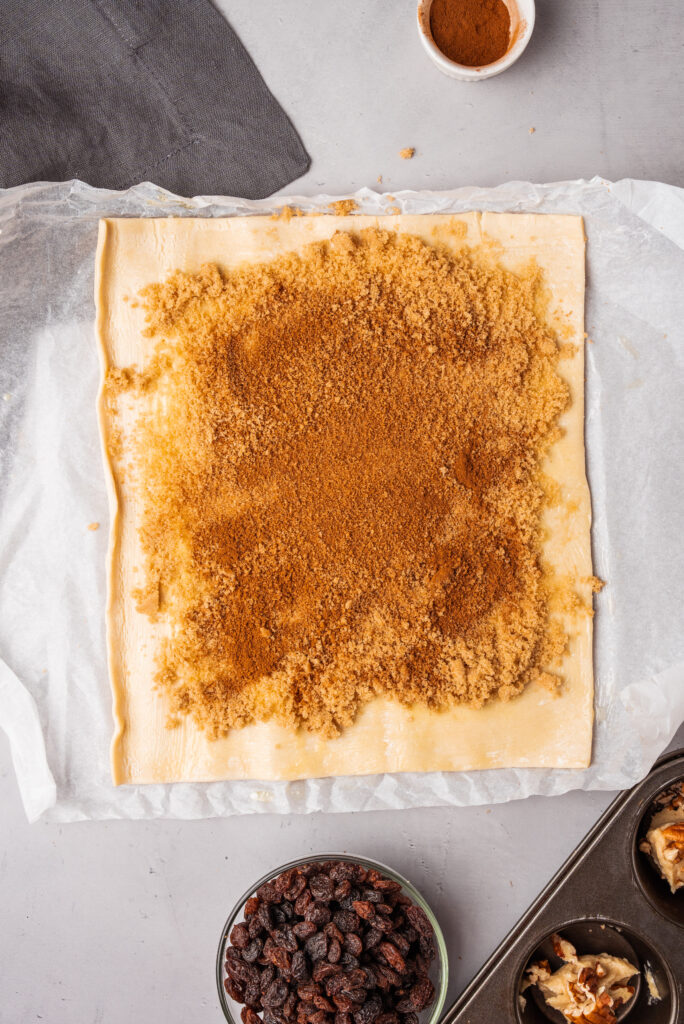 adding ingredients on flattened dough