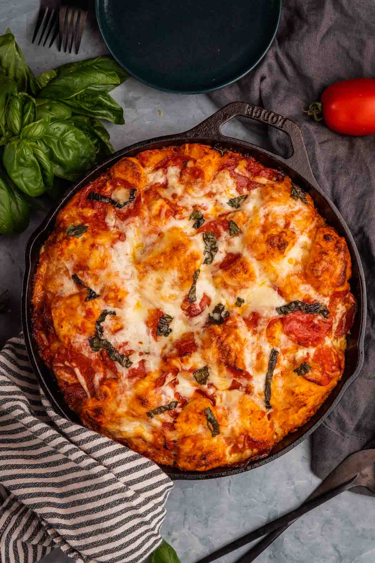 Overhead shot of cast iron skillet filled with bubble up pizza.