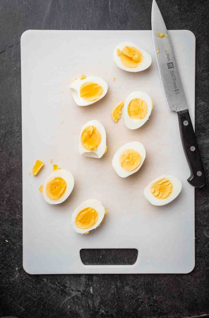 eggs on cutting board sliced in half