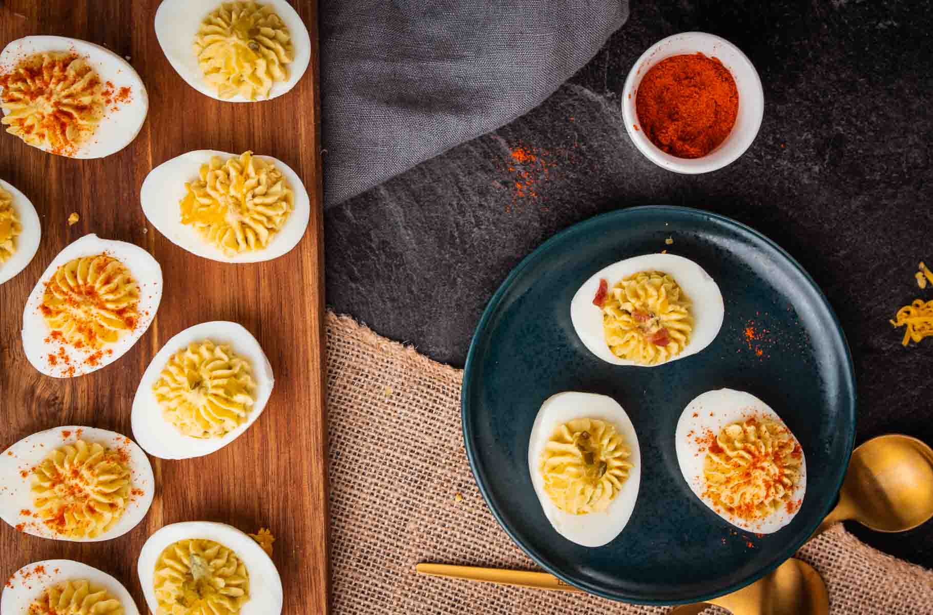 devilled eggs on a cutting board and a plate