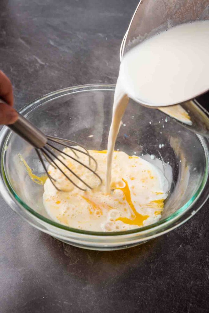 mixing wet ingredients in a glass bowl