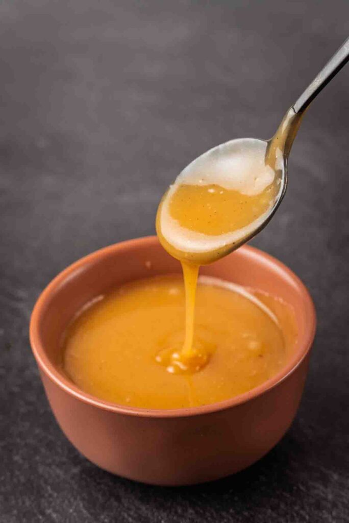 spoonful of sauce in a bowl