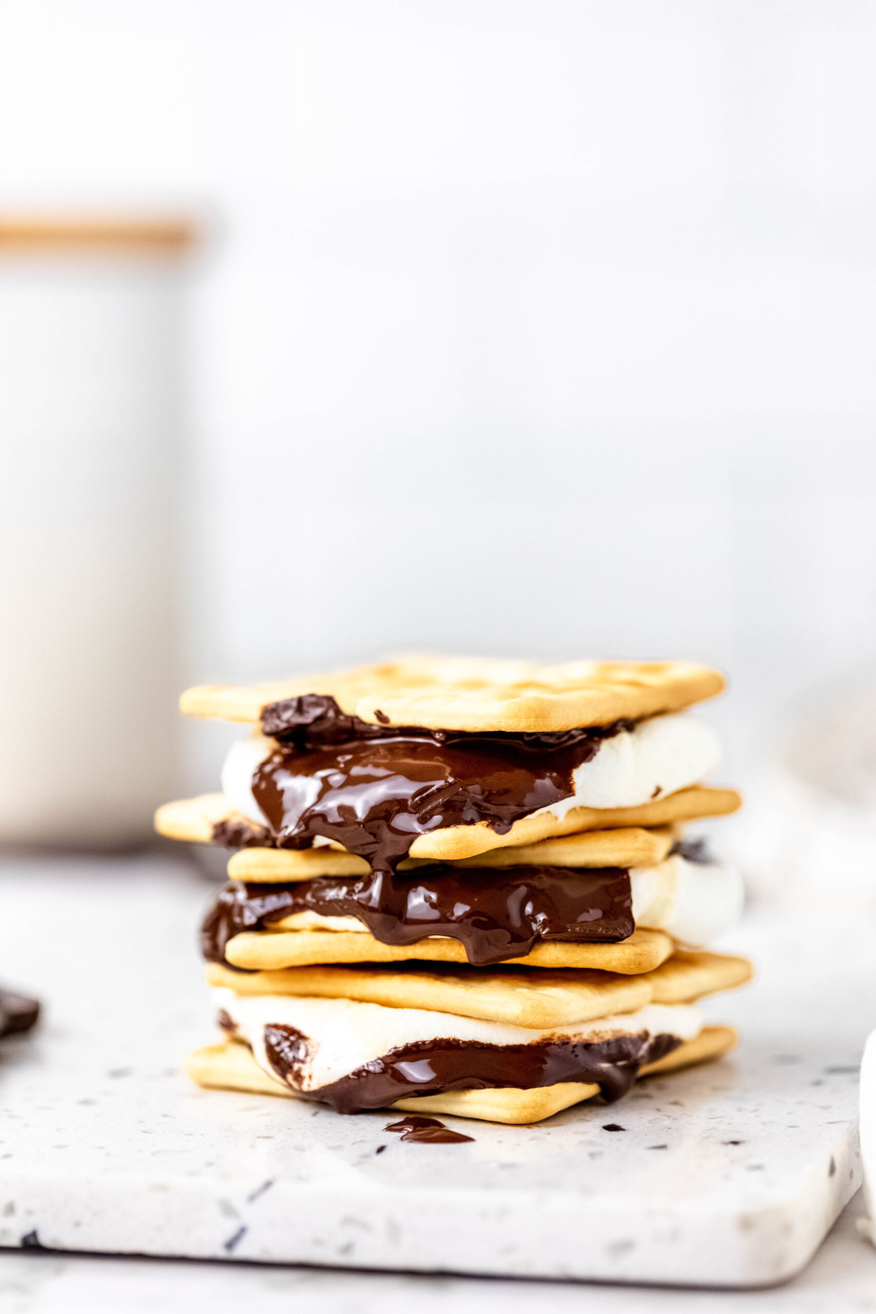 Stack of s'mores with melted chocolate.